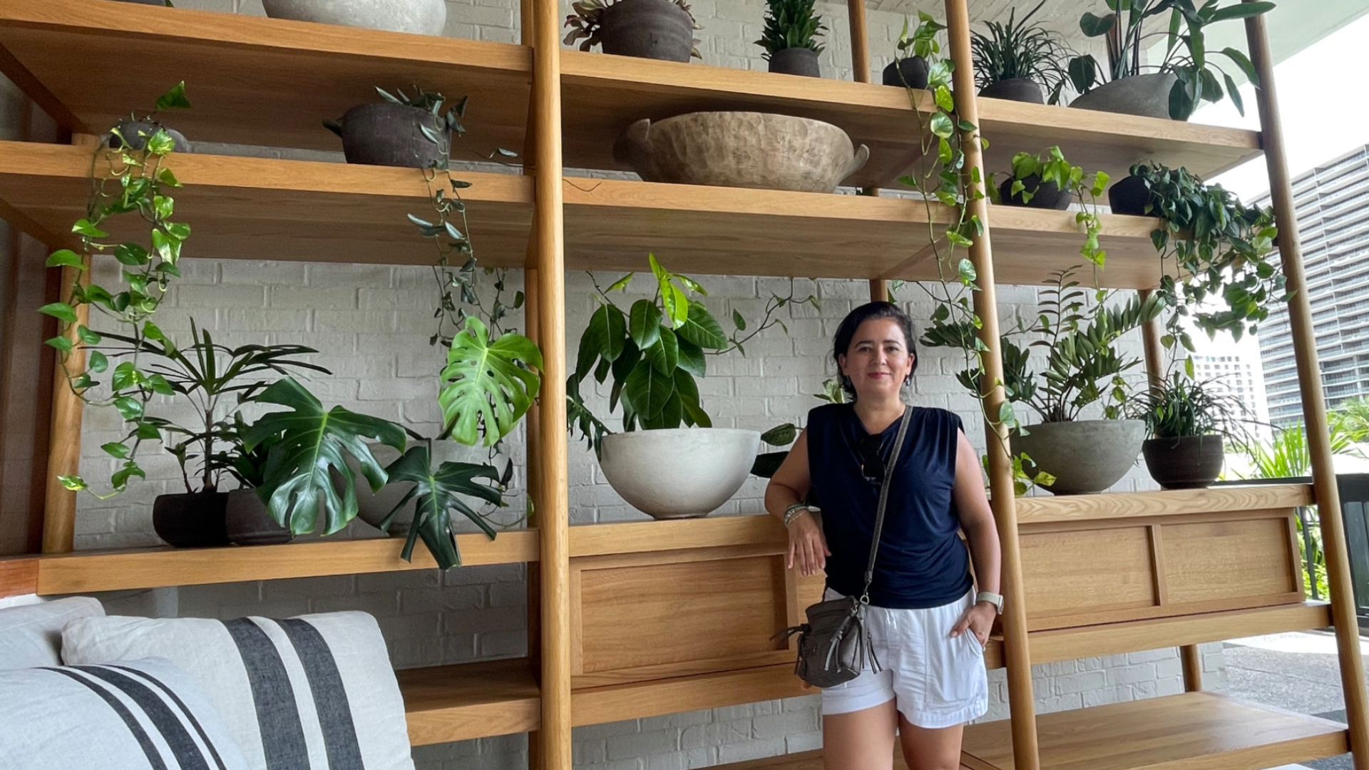 Betty Regalado next to some plants at Miami Beach