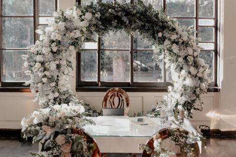 Photo from event. Flowers arranged on a table